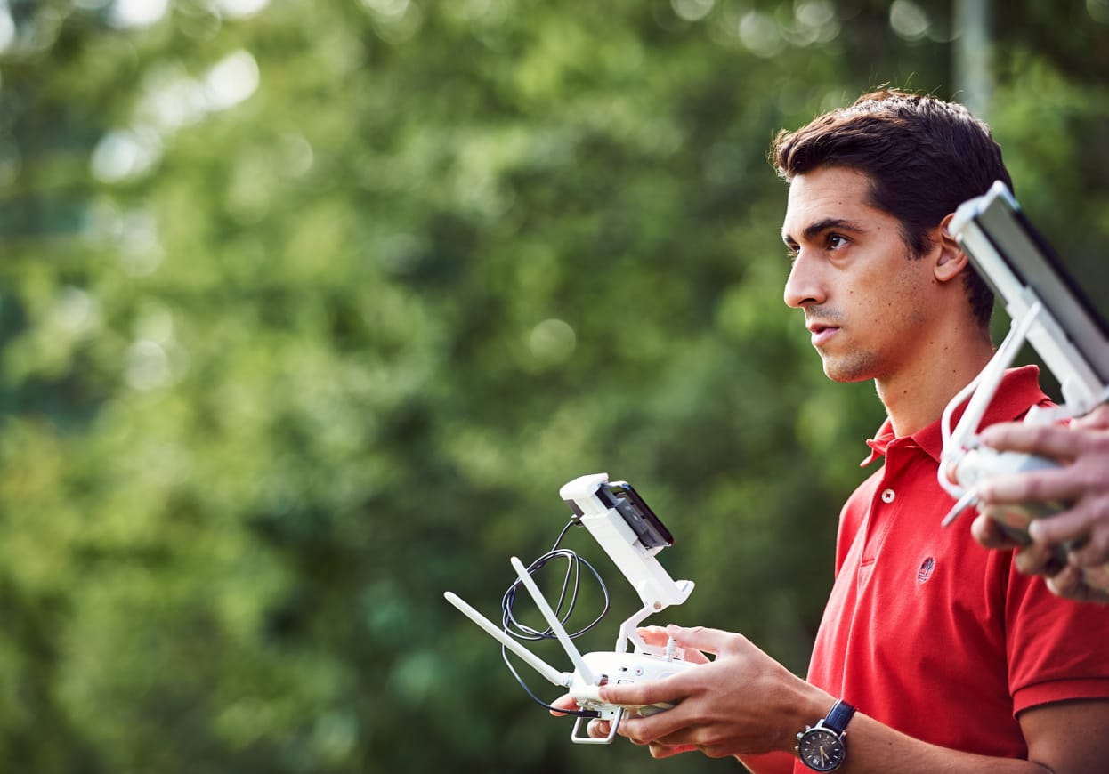 Man concentrating on flying a drone.